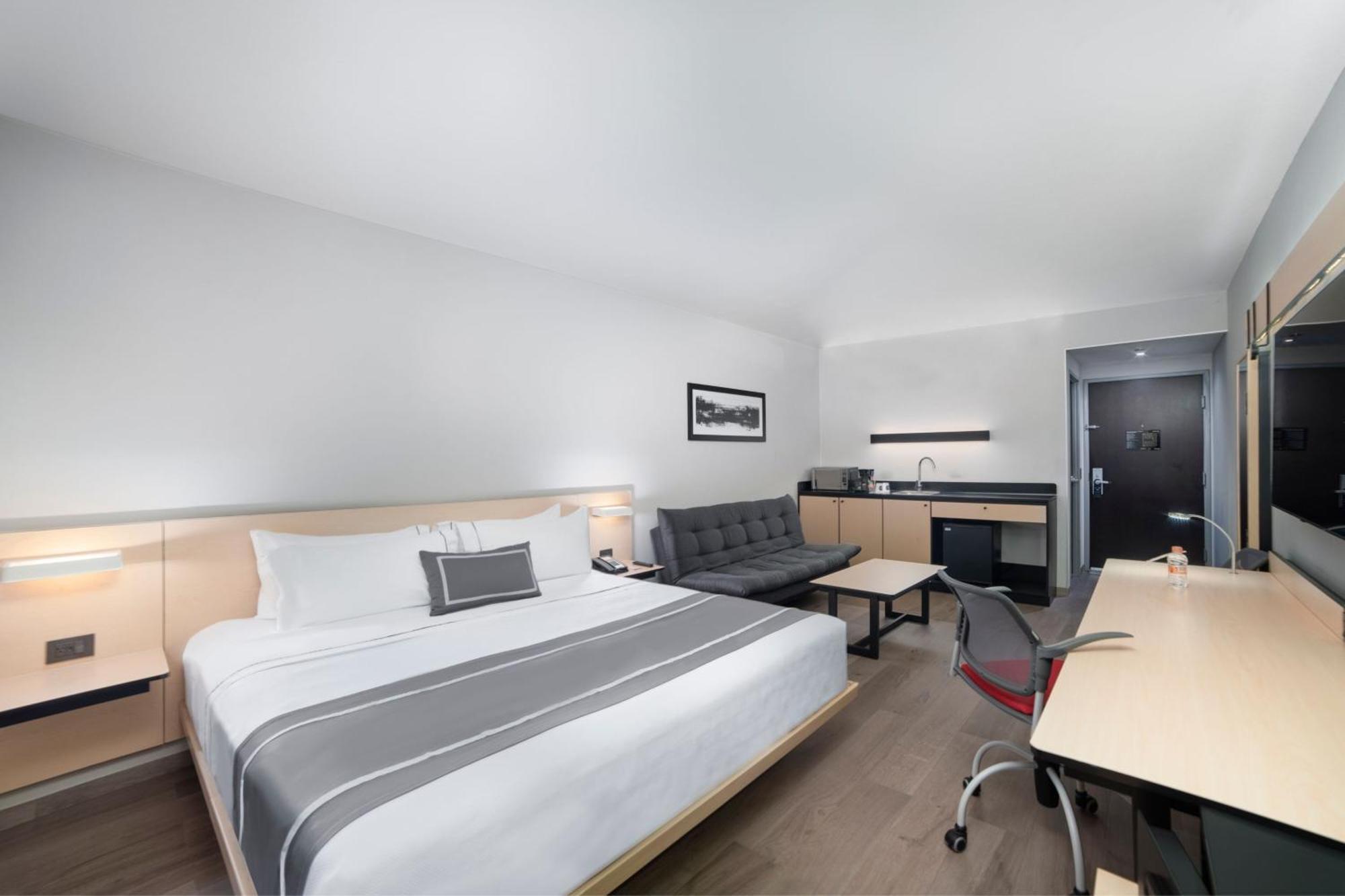Suite mit 1 Schlafzimmer, 1 Kingsize-Bett und 1 Schlafsofa